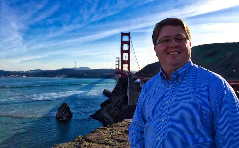 Tyler standing in front of the Golden Gate Bridge.